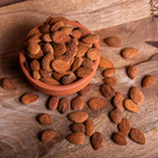 Shelled Sicilian almonds in a 1kg bag by Mandorlino d'Olio, showcasing their natural color and texture.