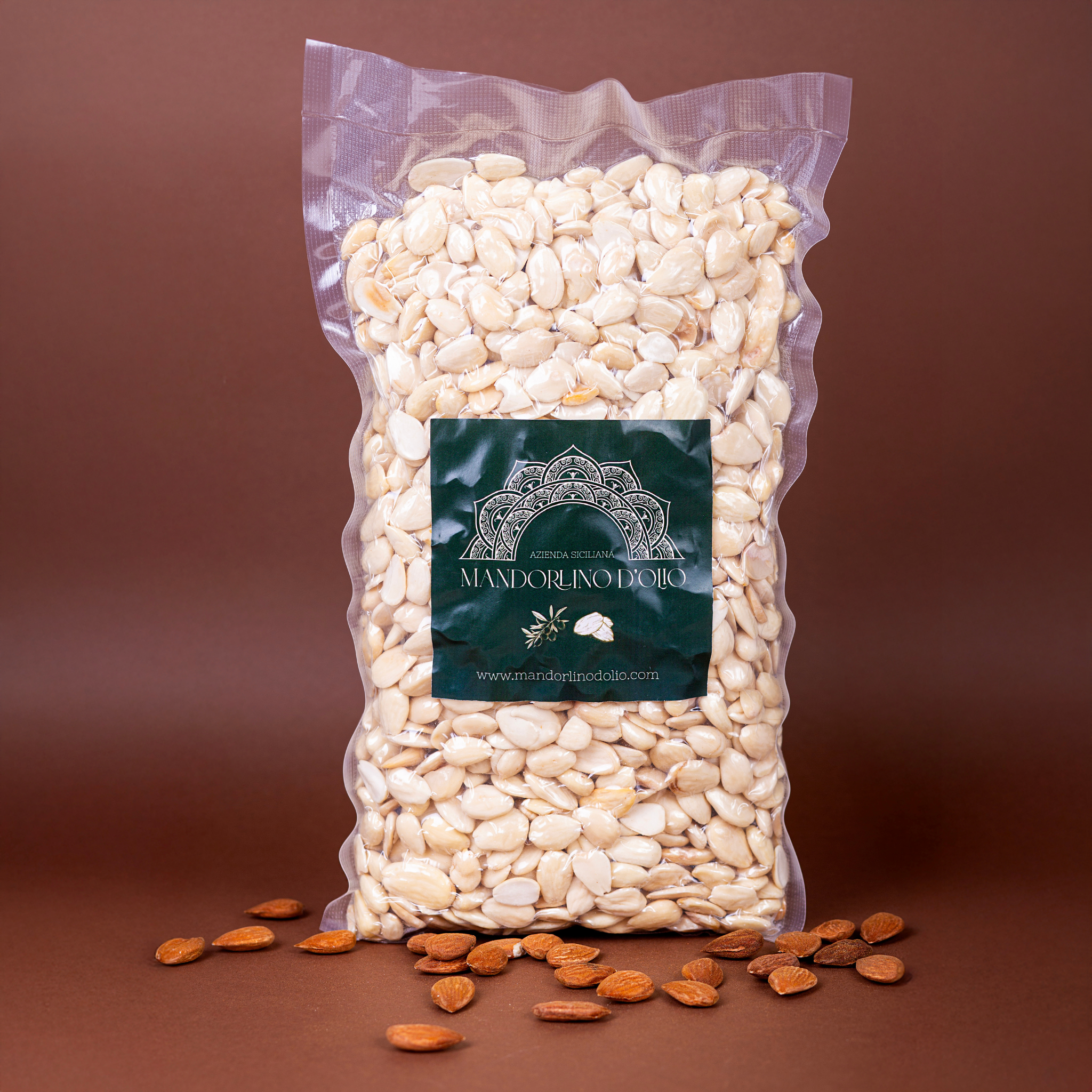 Sicilian blanched almonds in a 1 kg bag by Mandorlino d'olio, showcasing the product's natural texture and color.